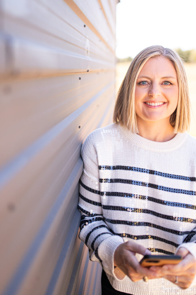 Kelli Rogers, Pinterest and blogging strategist for wedding professionals, smiling in a casual portrait.