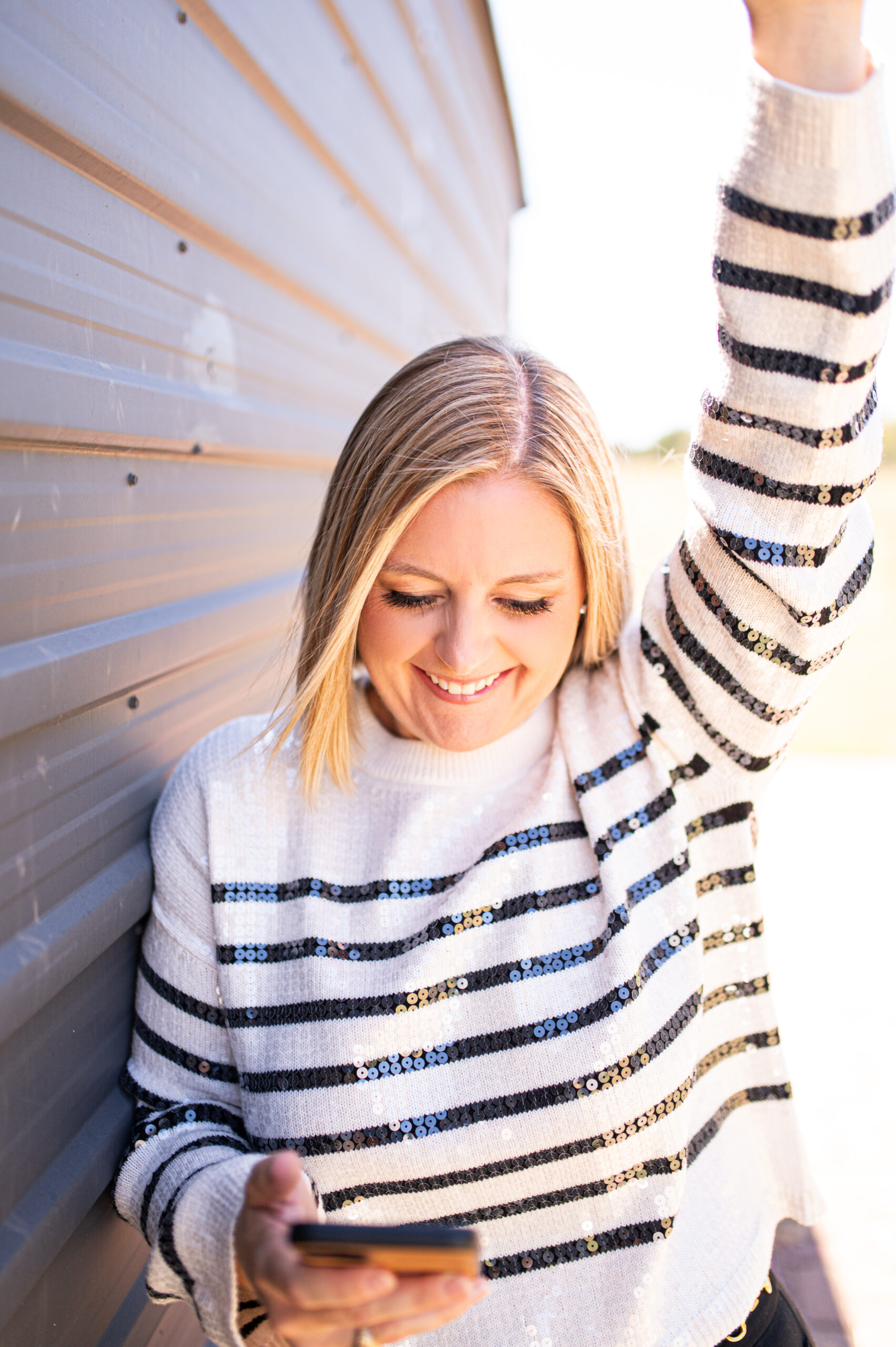 Kelli Rogers, Pinterest and blogging strategist for wedding professionals, smiling while reviewing a client’s content strategy for florists and planners.
